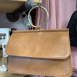 Fabulous Joy Susan. Wear crossbody, wrist handle.